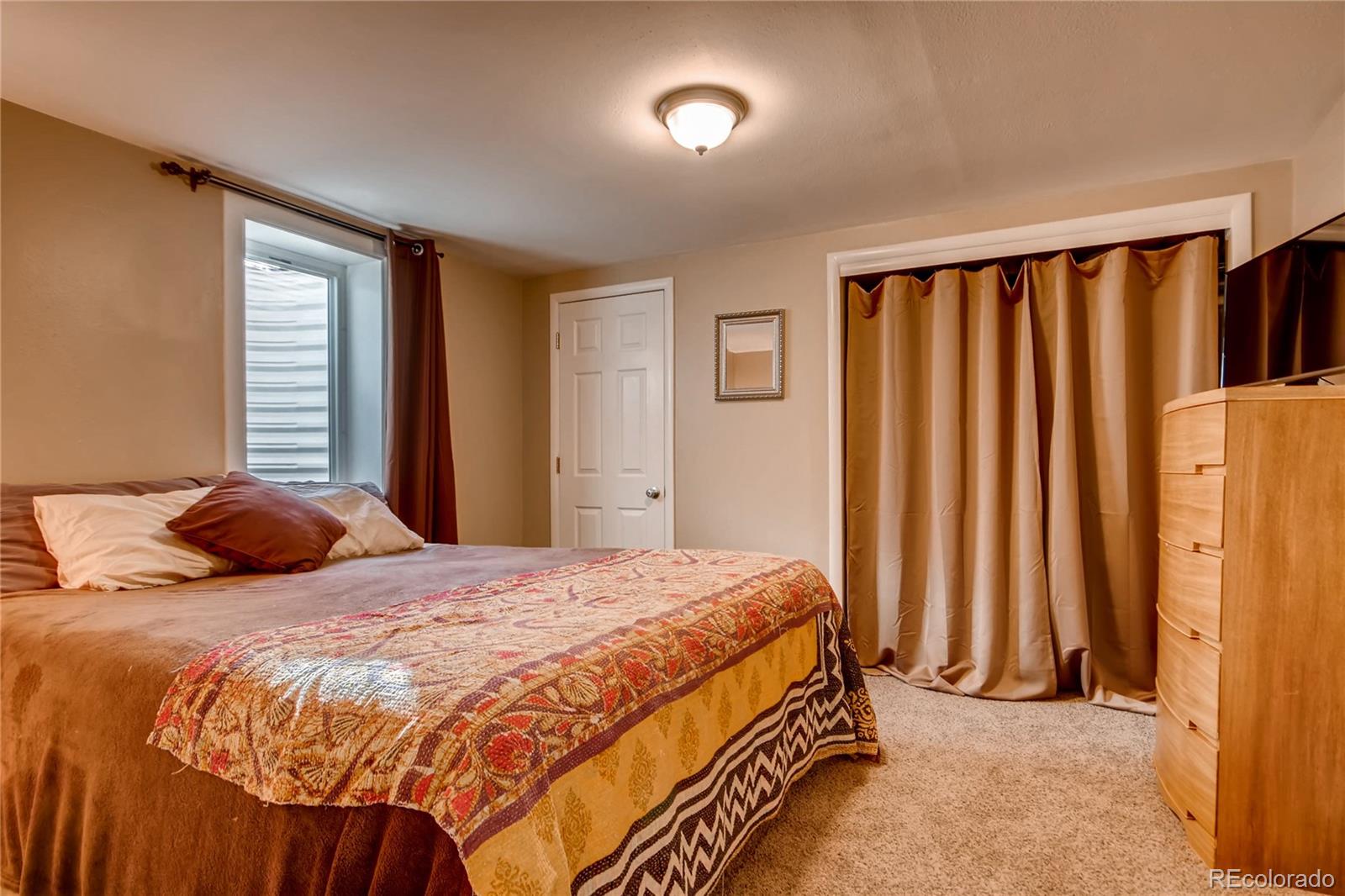 3315 West Pimlico Avenue Englewood, CO 80110 - Photo 23 of 35 a bedroom with a bed and a window