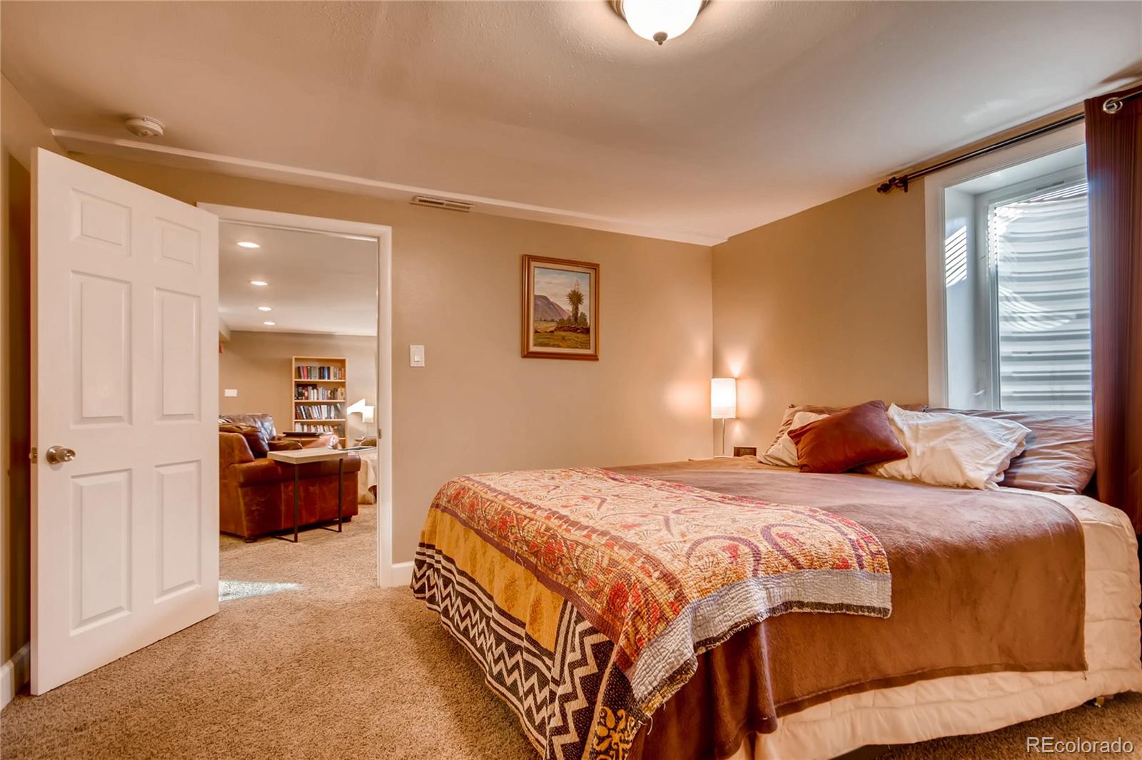 3315 West Pimlico Avenue Englewood, CO 80110 - Photo 24 of 35 a bedroom with a bed and a couch