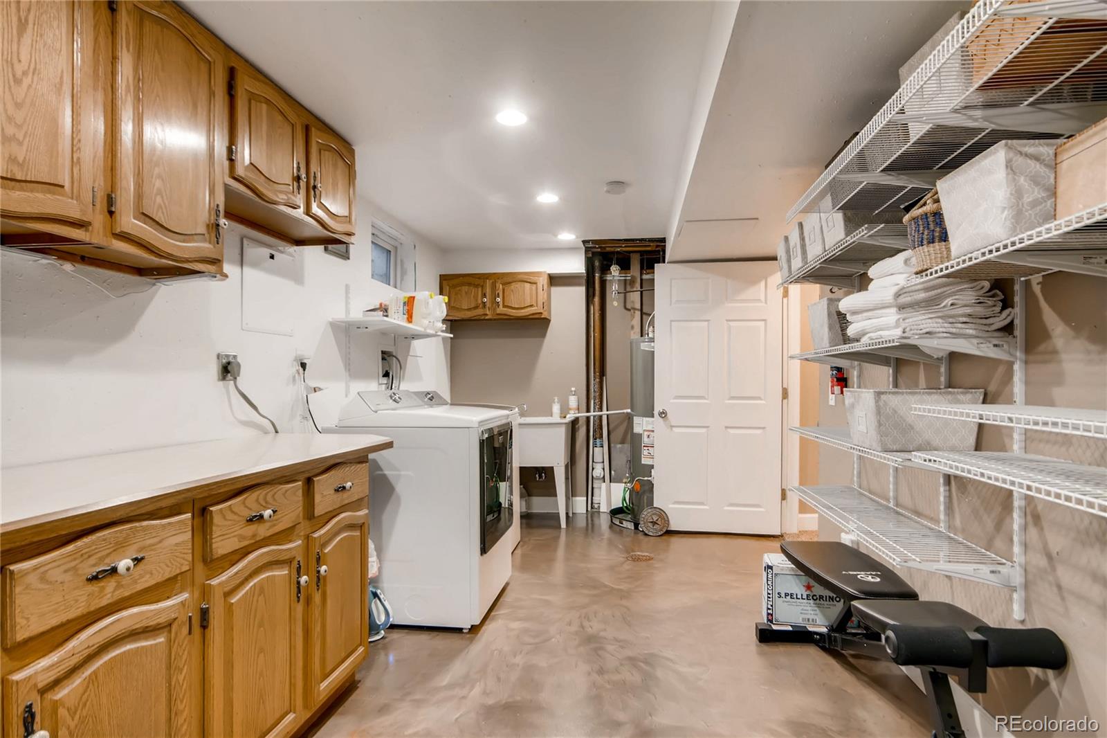 3315 West Pimlico Avenue Englewood, CO 80110 - Photo 26 of 35 a kitchen with cabinets and wooden floors
