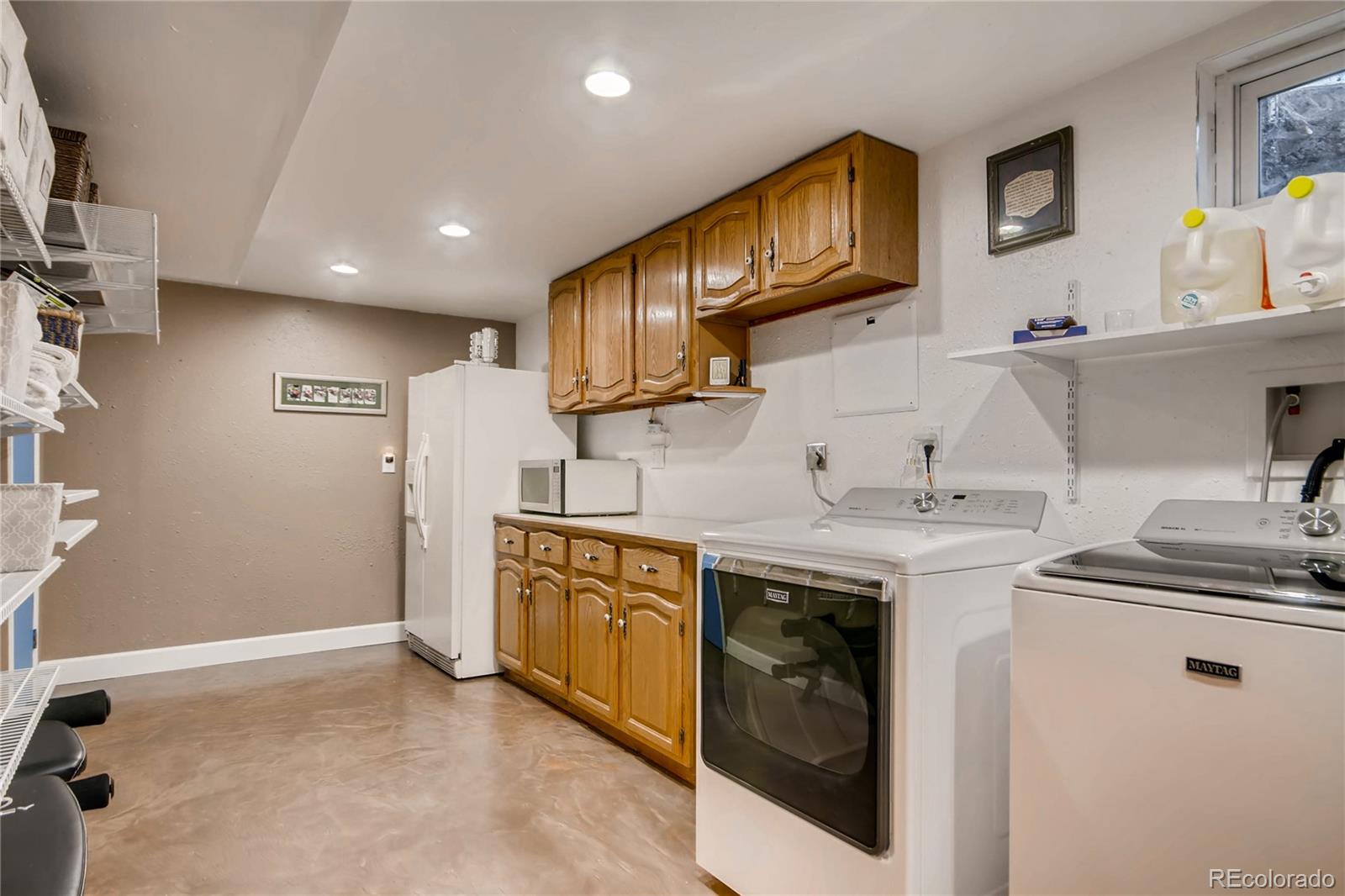 3315 West Pimlico Avenue Englewood, CO 80110 - Photo 27 of 35 a kitchen with stainless steel appliances granite countertop a sink stove and cabinets