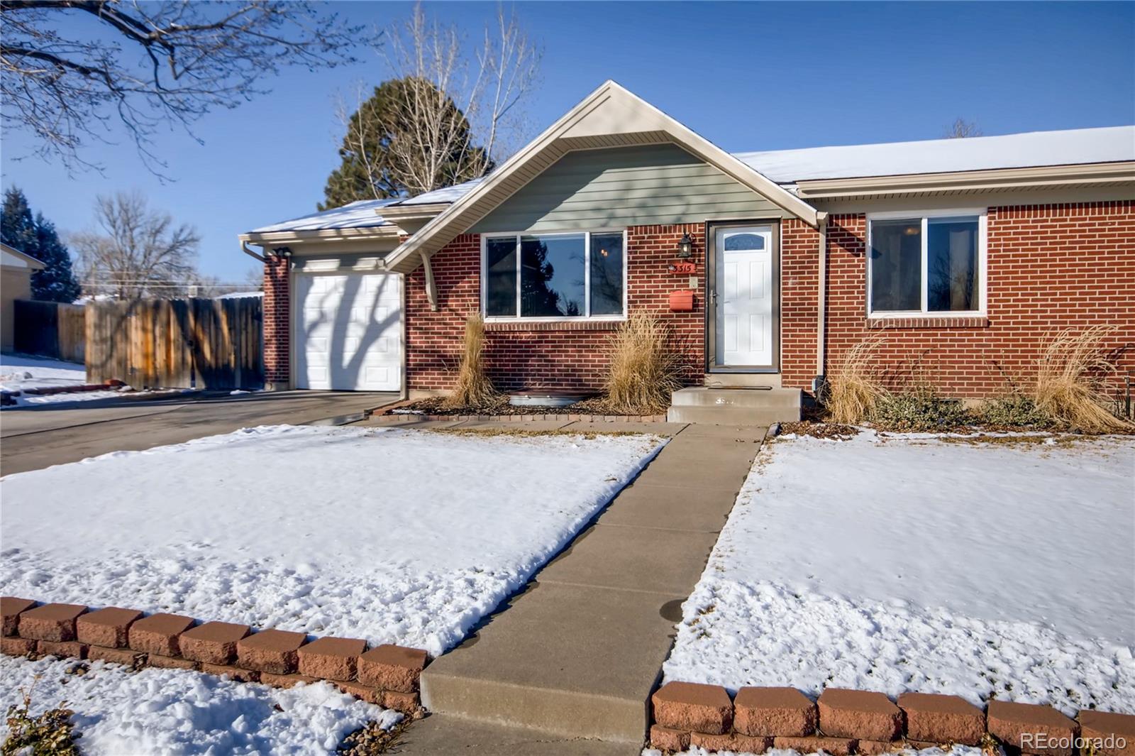 3315 West Pimlico Avenue Englewood, CO 80110 - Photo 3 of 35 a front view of a house with a yard
