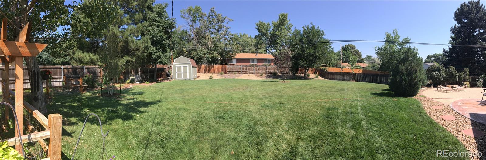 3315 West Pimlico Avenue Englewood, CO 80110 - Photo 35 of 35 a view of a house with backyard sitting area and garden