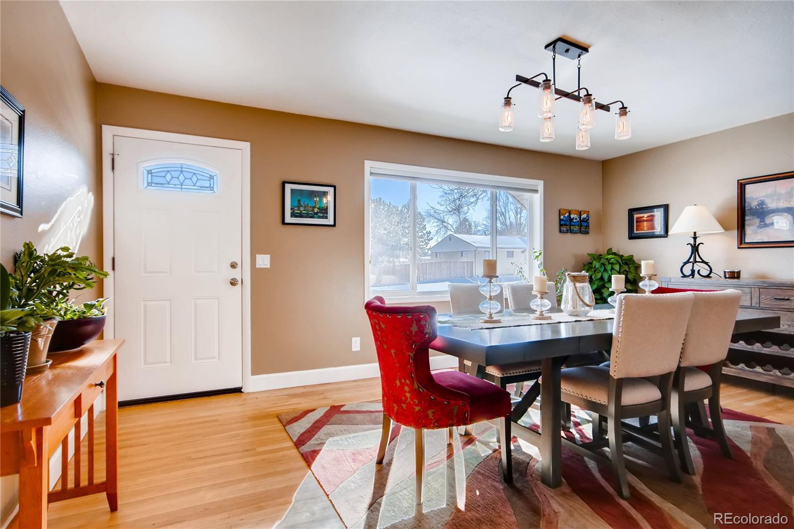 3315 West Pimlico Avenue Englewood, CO 80110 - Photo 4 of 35 a view of a dining room with furniture window and wooden floor