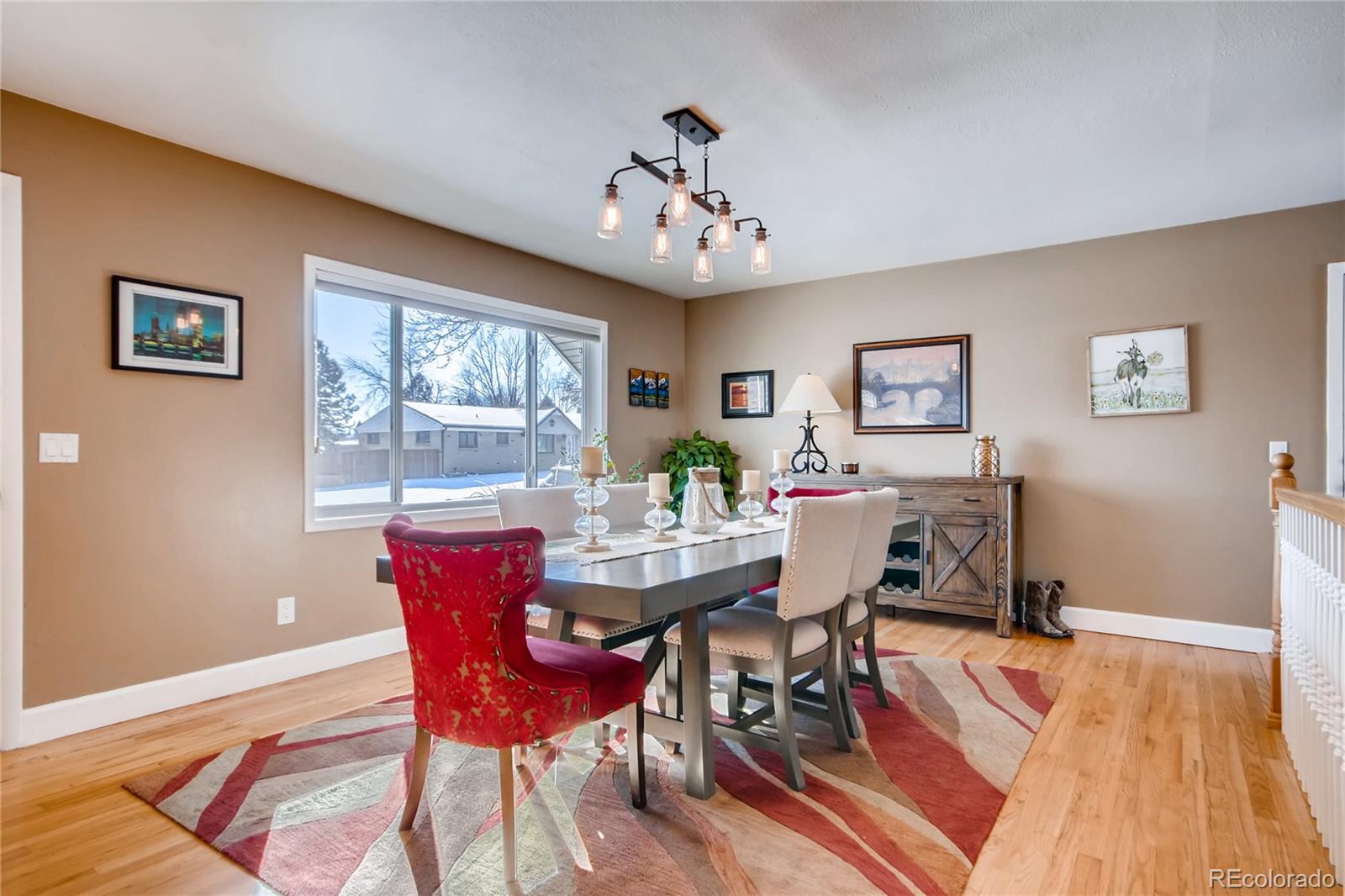 3315 West Pimlico Avenue Englewood, CO 80110 - Photo 5 of 35 a view of a dining room with furniture window and wooden floor