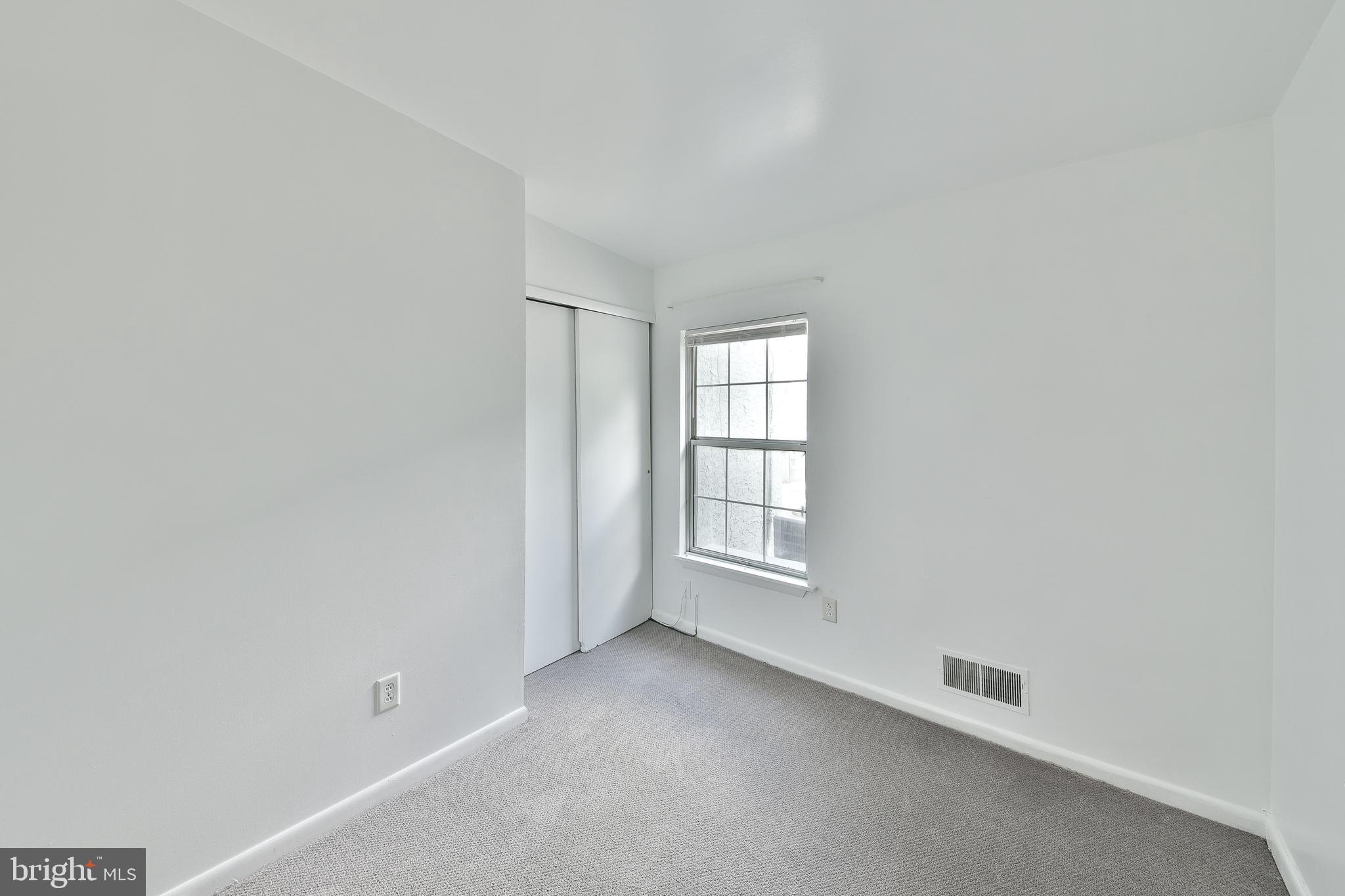 357 Lyceum Avenue Philadelphia, PA 19128 - Photo 16 of 21 an empty room with windows