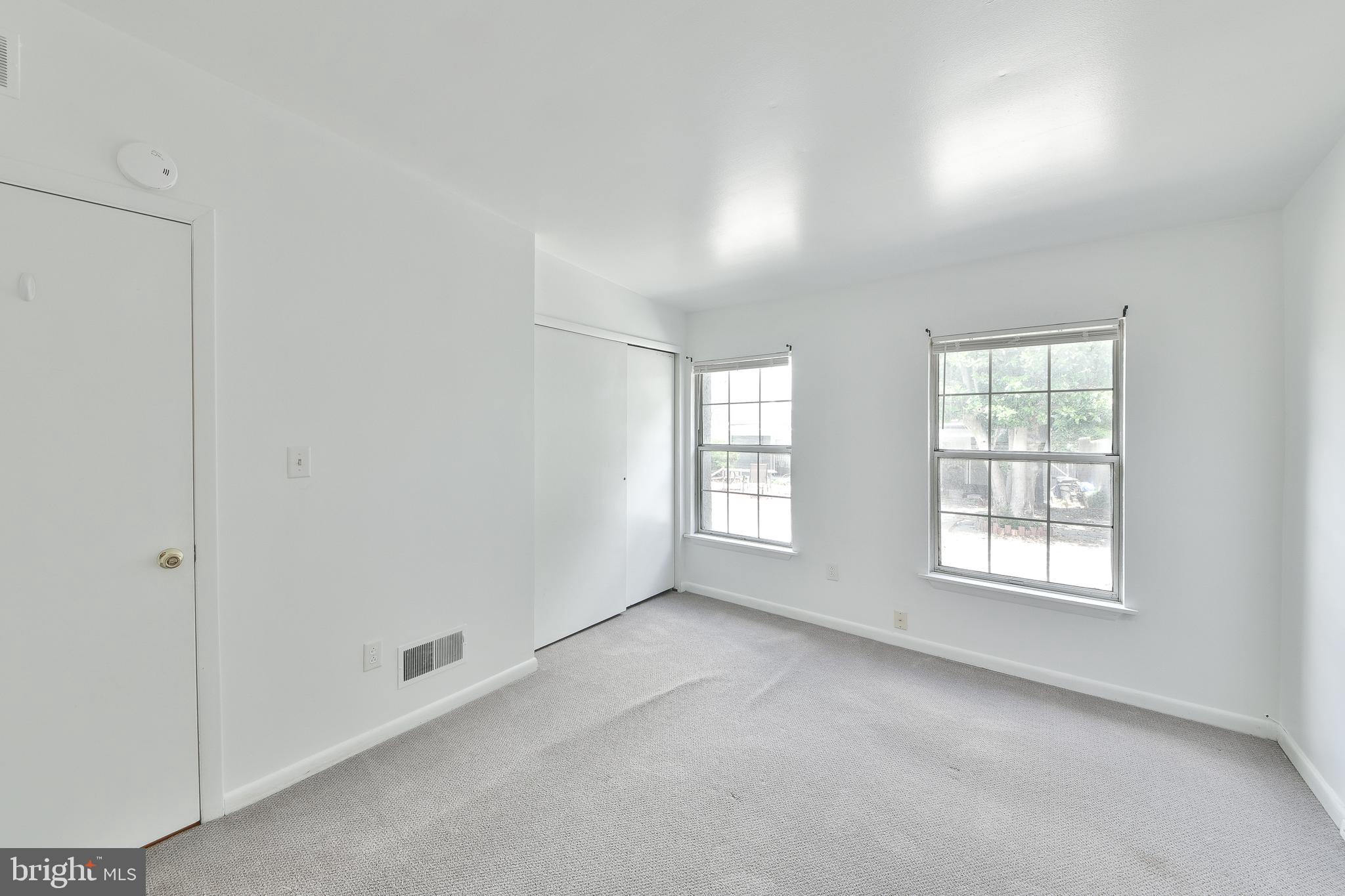 357 Lyceum Avenue Philadelphia, PA 19128 - Photo 18 of 21 an empty room with windows