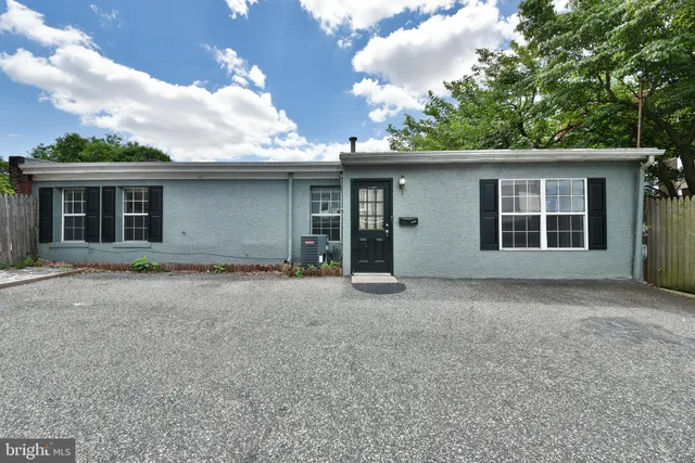 a house with trees in the background