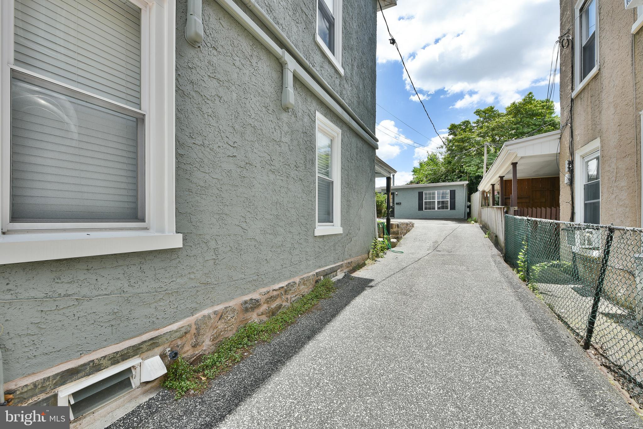 357 Lyceum Avenue Philadelphia, PA 19128 - Photo 4 of 21 a front view of a house with a yard