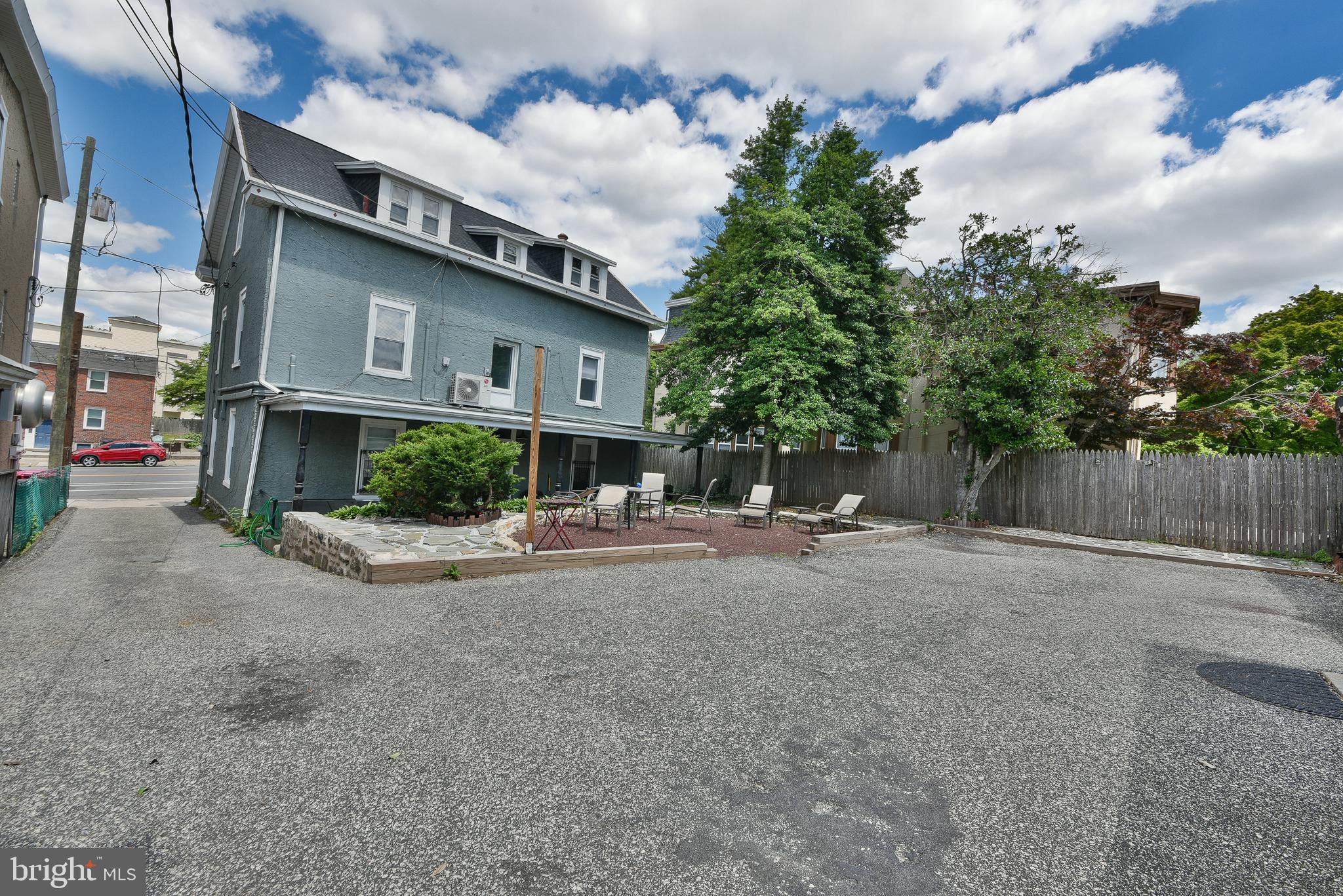 357 Lyceum Avenue Philadelphia, PA 19128 - Photo 6 of 21 a view of a house with a yard and garage
