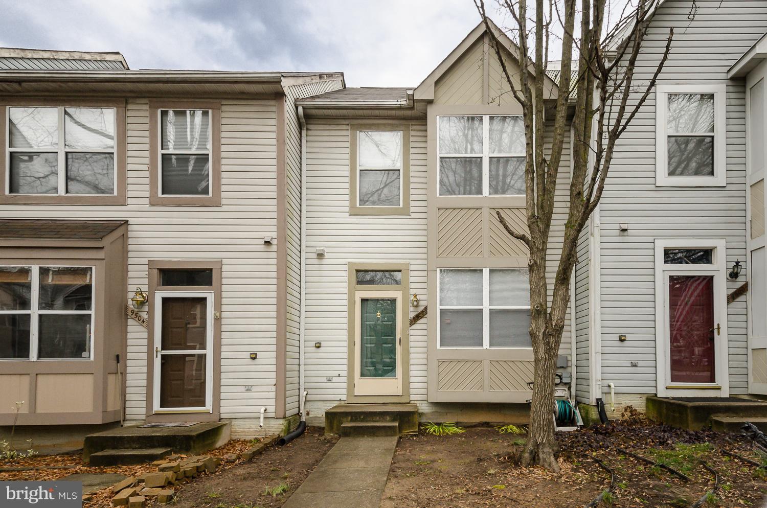 9502 Clocktower Lane Columbia, MD 21046 - Photo 1 of 12 a view of a house with a window and wooden house