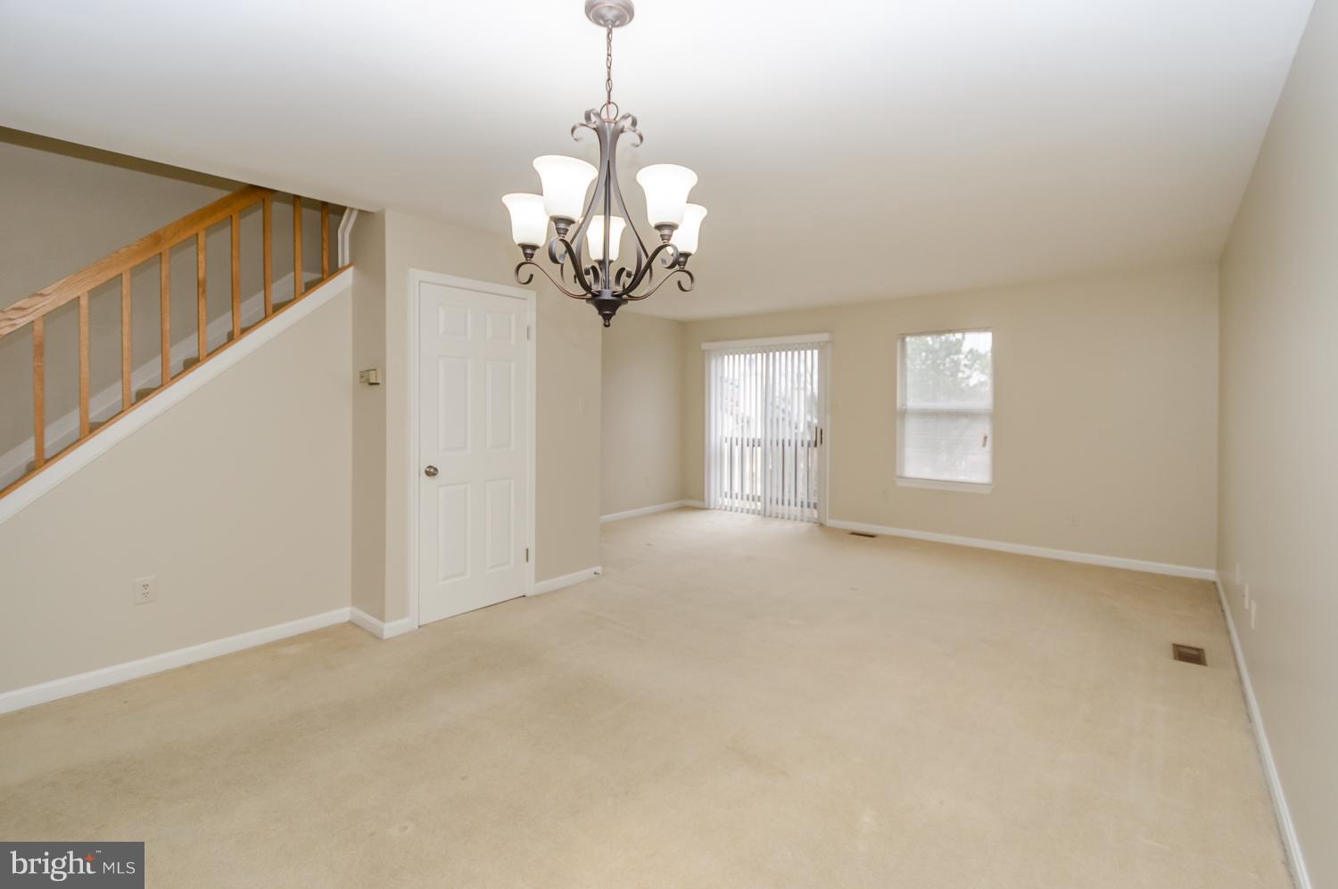 9502 Clocktower Lane Columbia, MD 21046 - Photo 5 of 12 a view of a livingroom with a chandelier