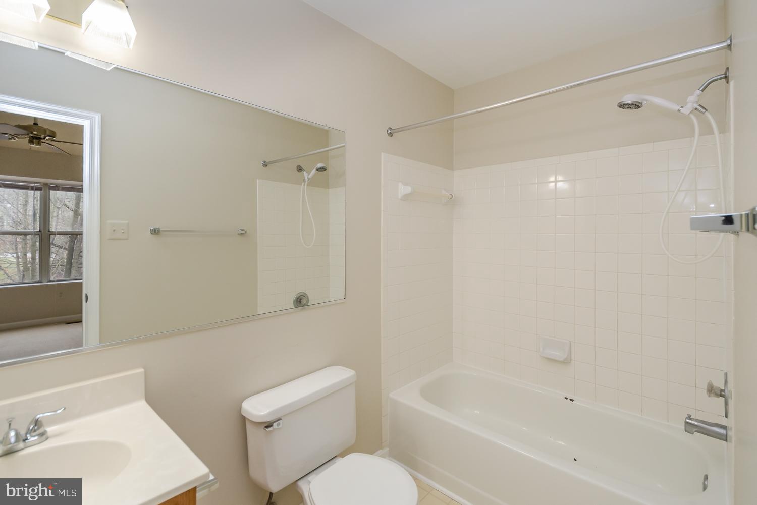 9502 Clocktower Lane Columbia, MD 21046 - Photo 8 of 12 a bathroom with a bathtub shower sink vanity and toilet