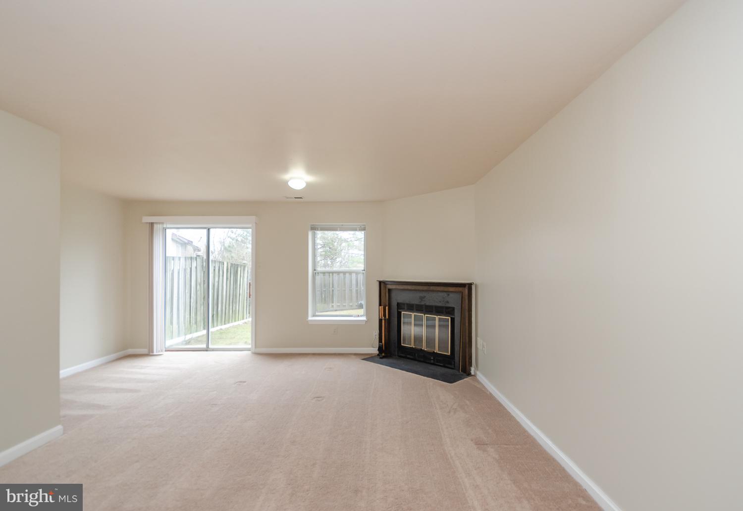 9502 Clocktower Lane Columbia, MD 21046 - Photo 10 of 12 a view of empty room with a fireplace