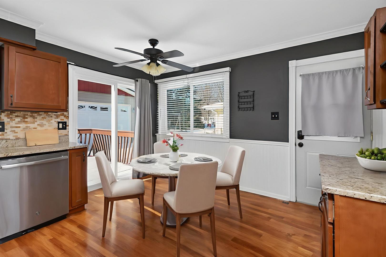 992 Navajo Street Carol Stream, IL 60188 - Photo 9 of 28 a dining room with furniture a chandelier and wooden floor