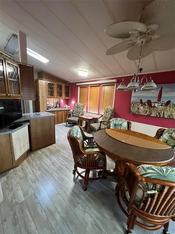 a kitchen with stainless steel appliances granite countertop a sink and a stove