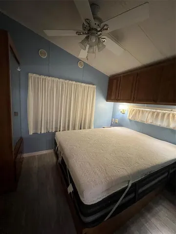 a bedroom with furniture and a window