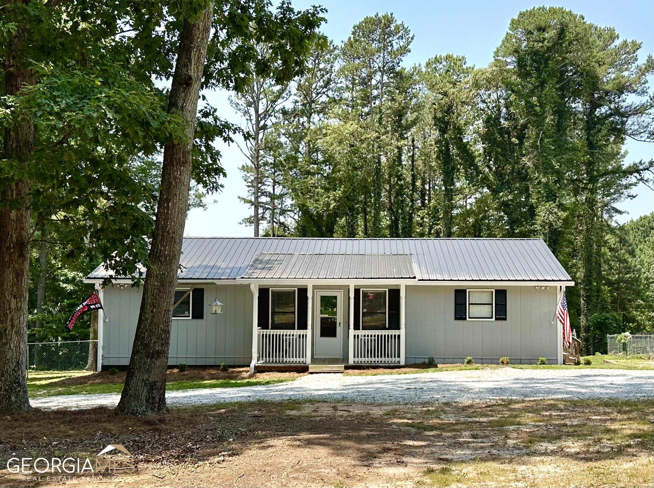 1748 Walton Road Monroe, GA 30656 - Photo 1 of 1 a front view of a house with a yard