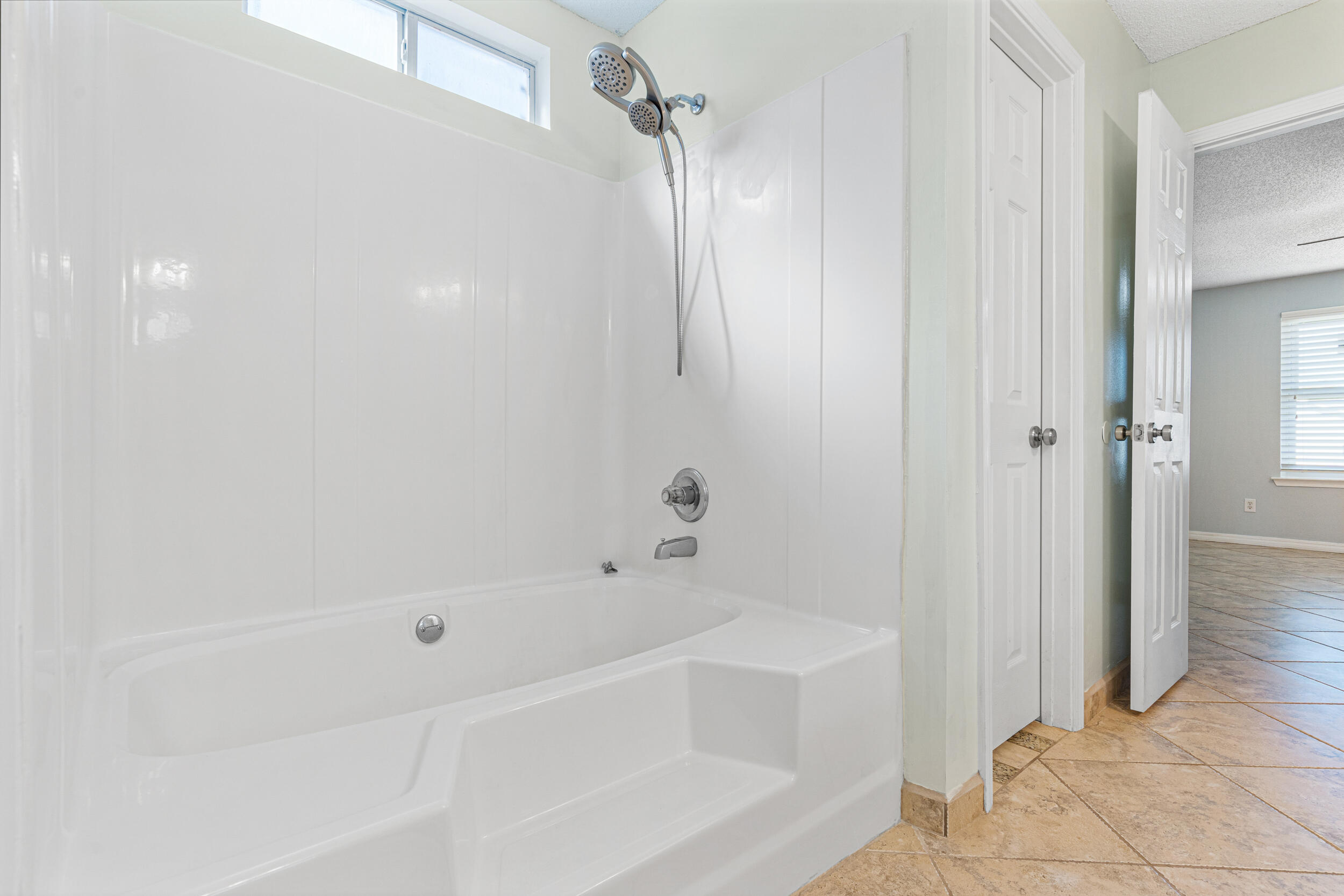 7933 Skyview Boulevard Navarre, FL 32566 - Photo 16 of 38 a white bath tub sitting next to a shower