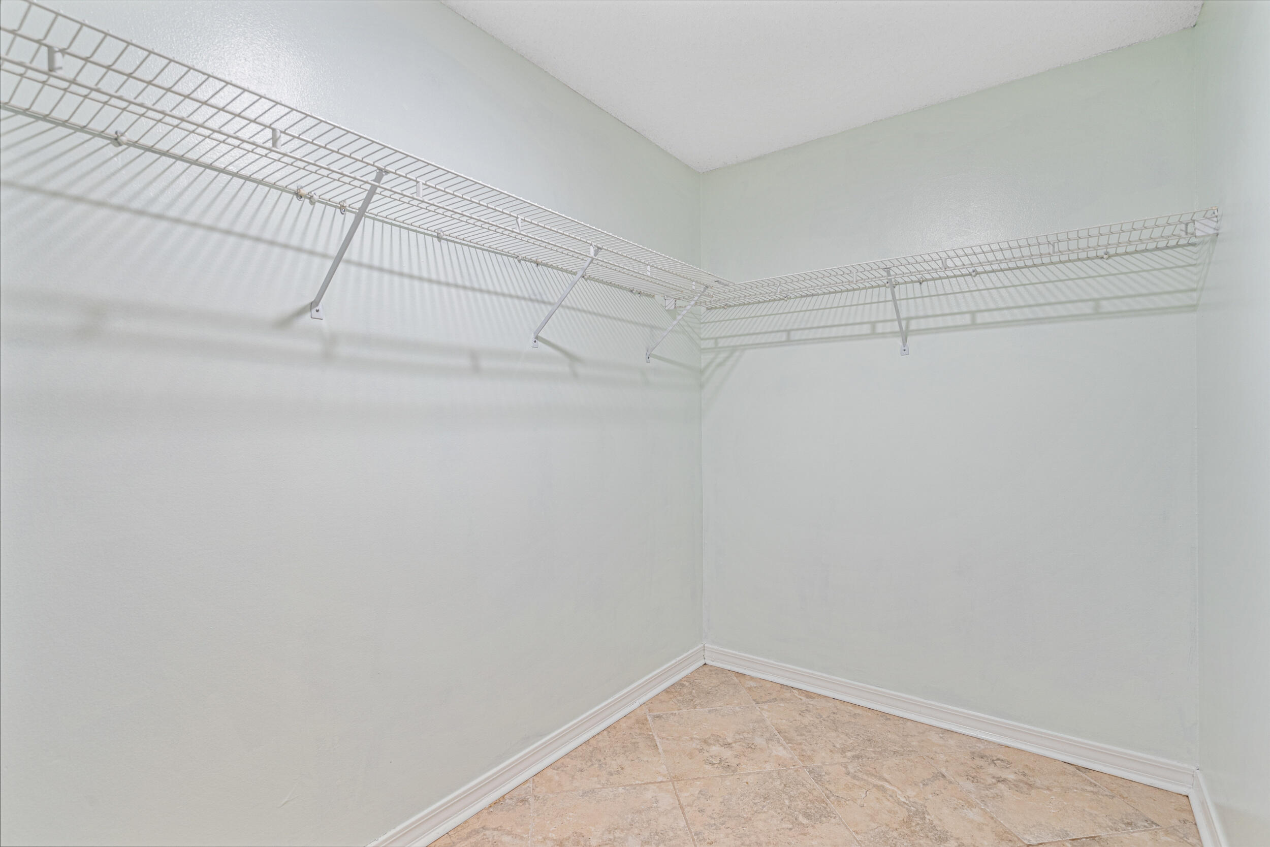 7933 Skyview Boulevard Navarre, FL 32566 - Photo 17 of 38 a view of a room with racks on the wall