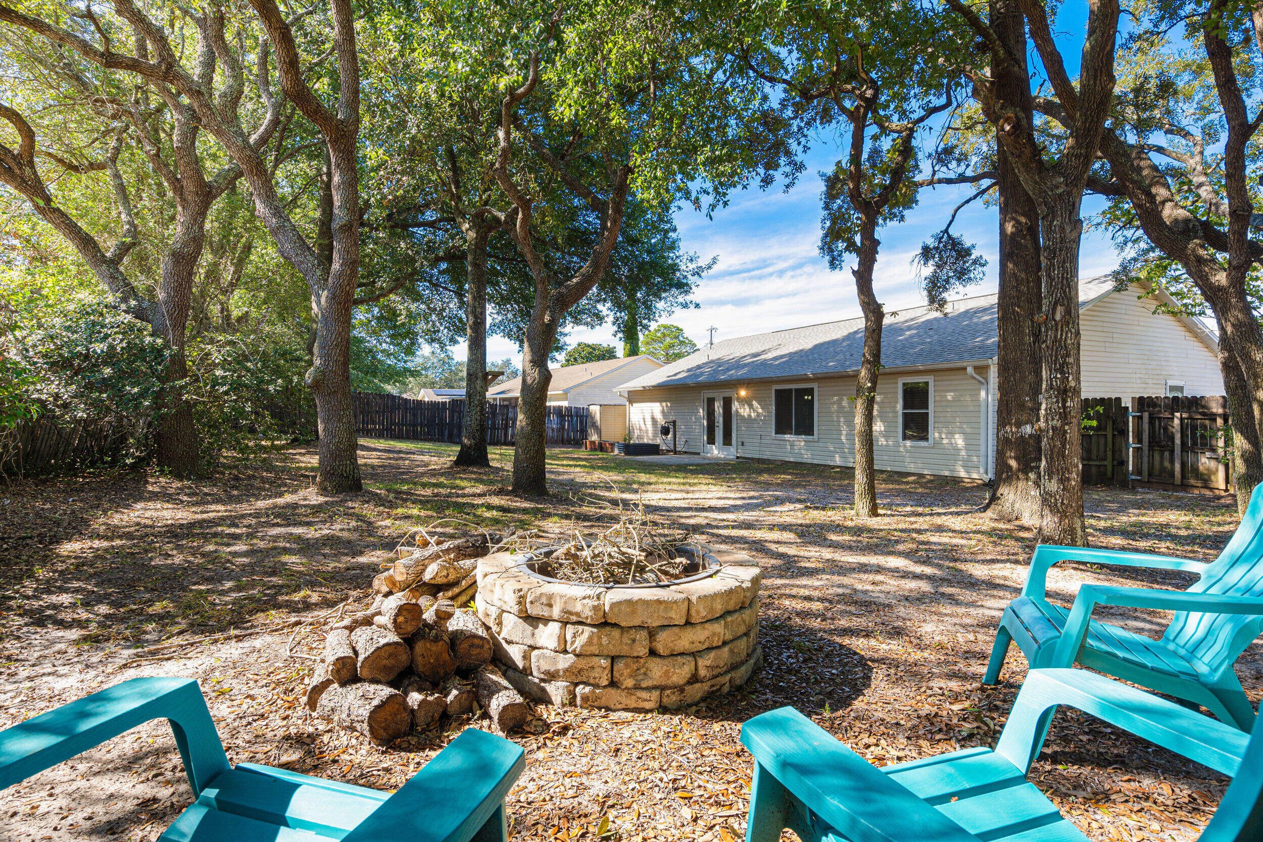 7933 Skyview Boulevard Navarre, FL 32566 - Photo 27 of 38 a view of a house with backyard tub and sitting area