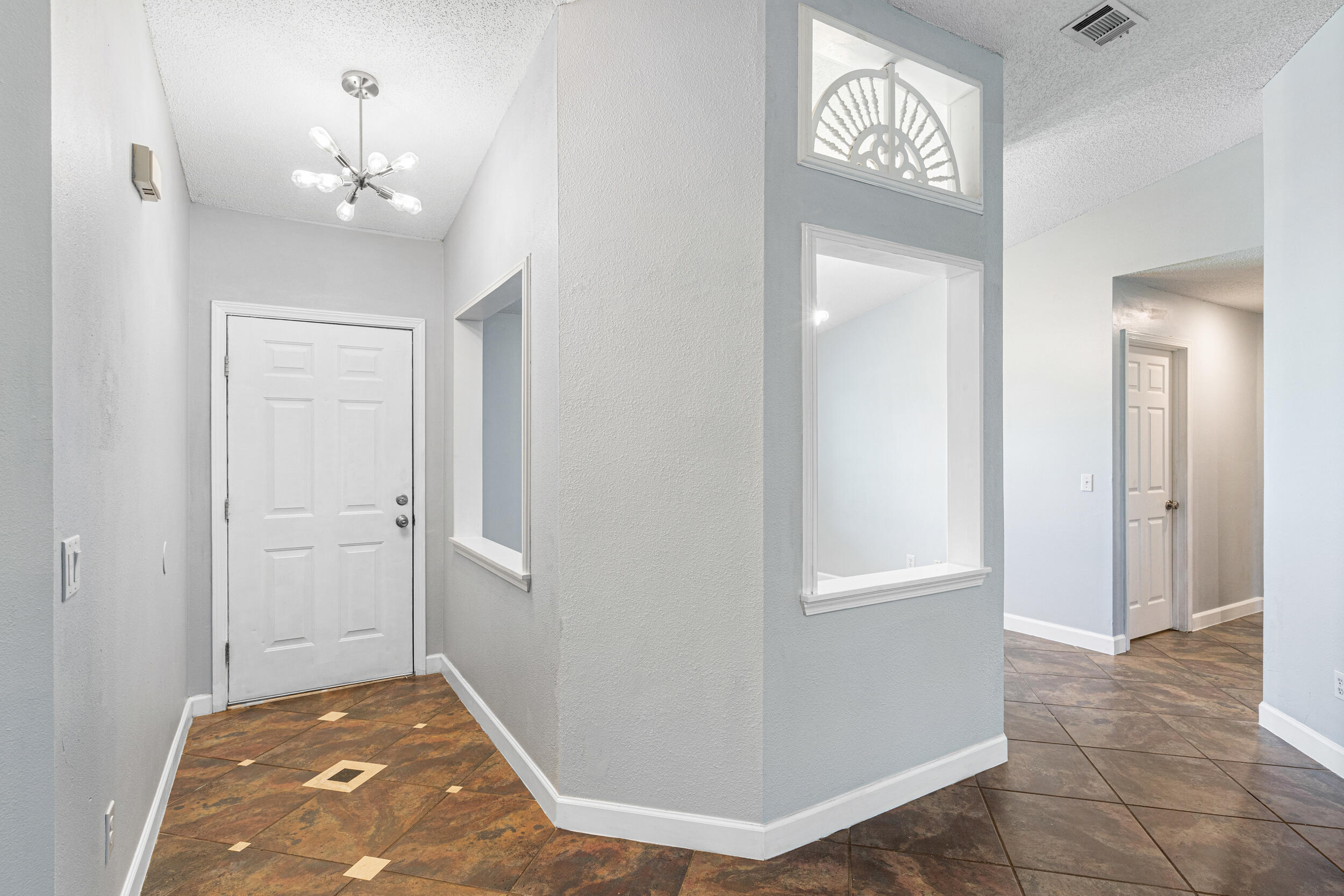 7933 Skyview Boulevard Navarre, FL 32566 - Photo 3 of 38 a view of a hallway with a hallway