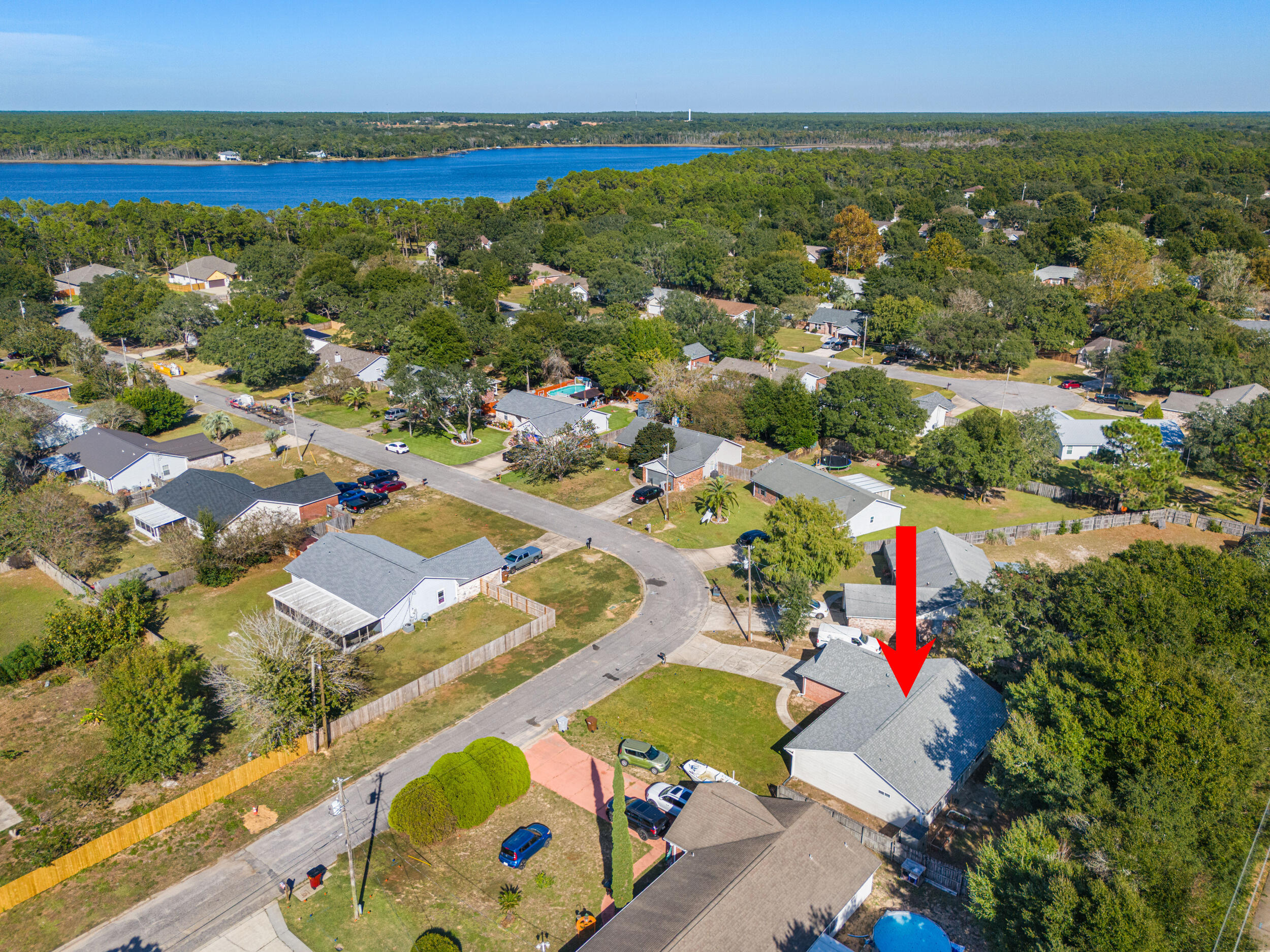 7933 Skyview Boulevard Navarre, FL 32566 - Photo 34 of 38 an aerial view of residential houses with outdoor space
