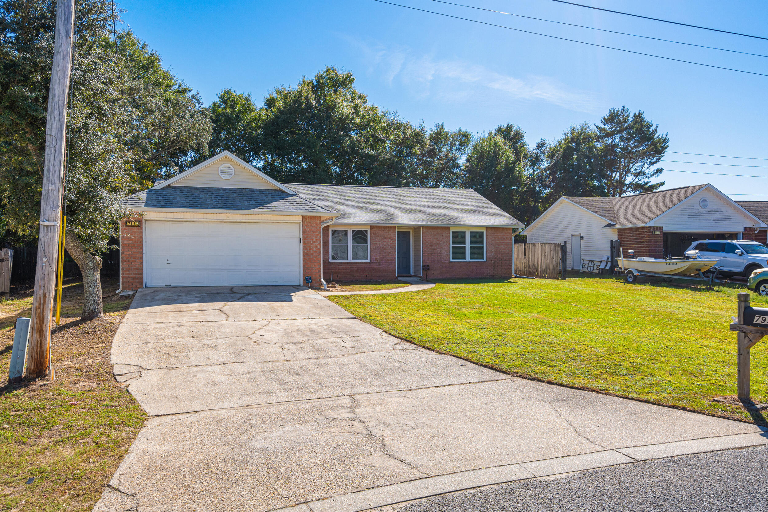 7933 Skyview Boulevard Navarre, FL 32566 - Photo 38 of 38 a house with swimming pool in front of it