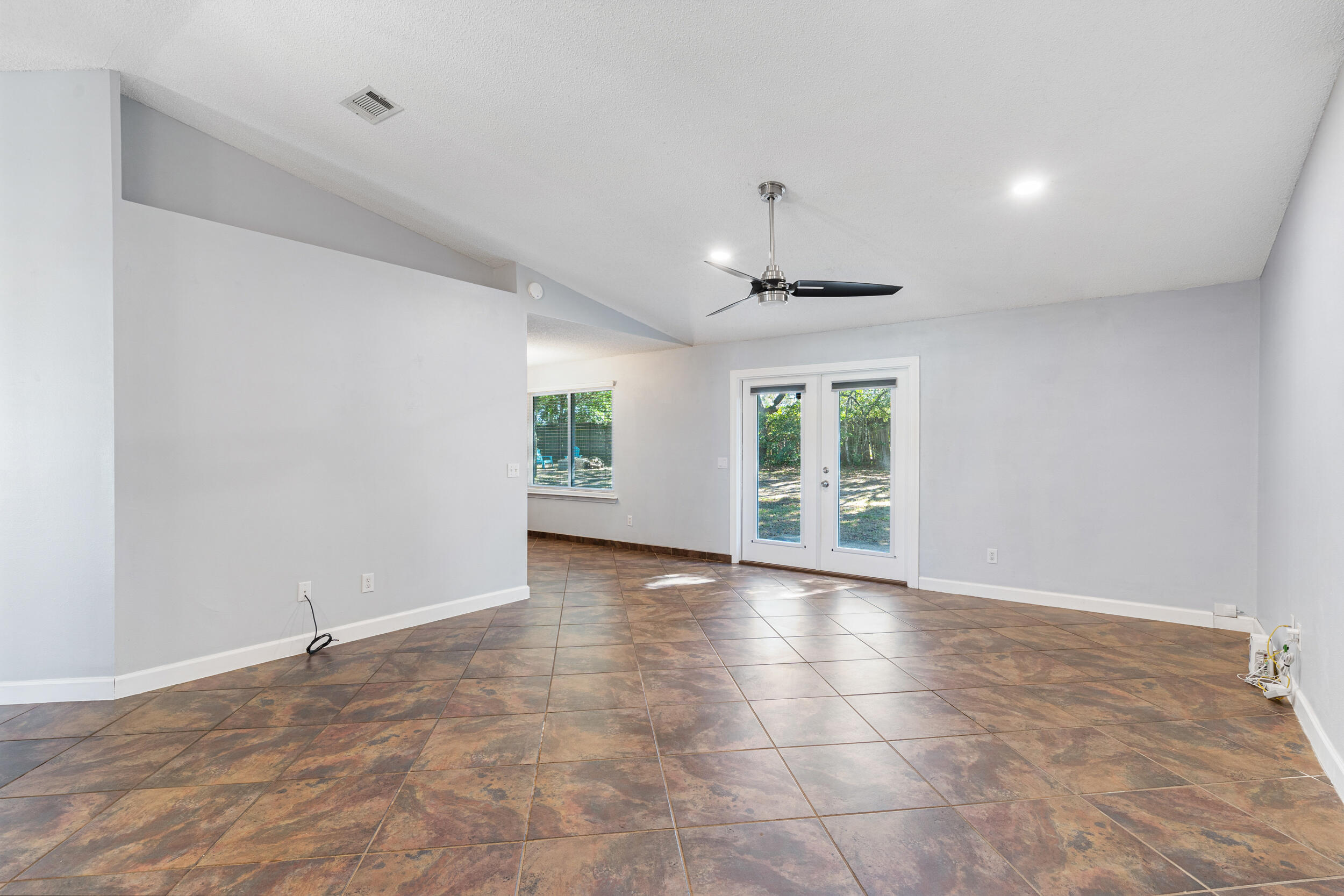 7933 Skyview Boulevard Navarre, FL 32566 - Photo 6 of 38 a view of an empty room with a window