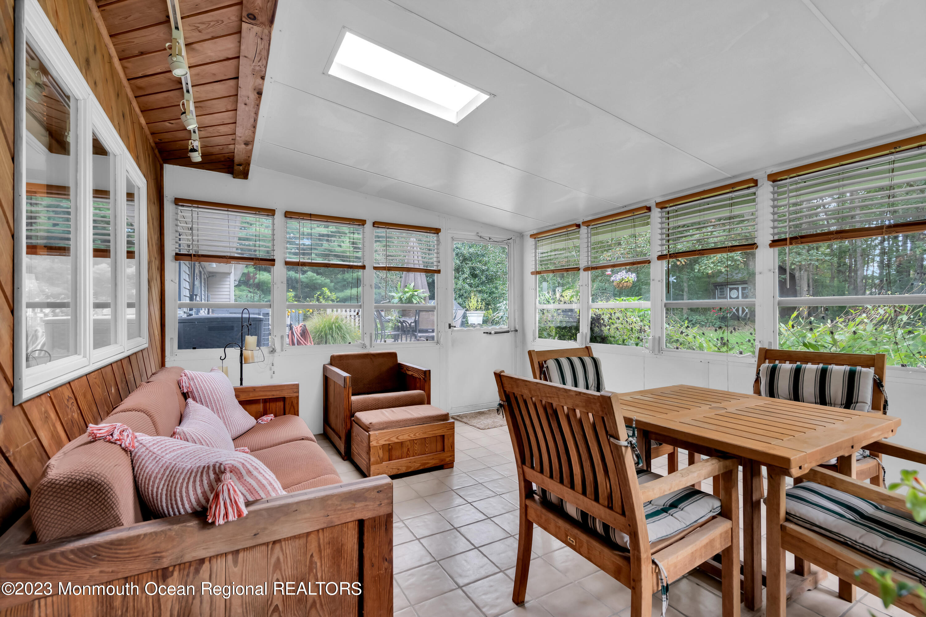 442 Frank Applegate Road Jackson, NJ 08527 - Photo 20 of 88 a view of a dining room with furniture large windows and wooden floor