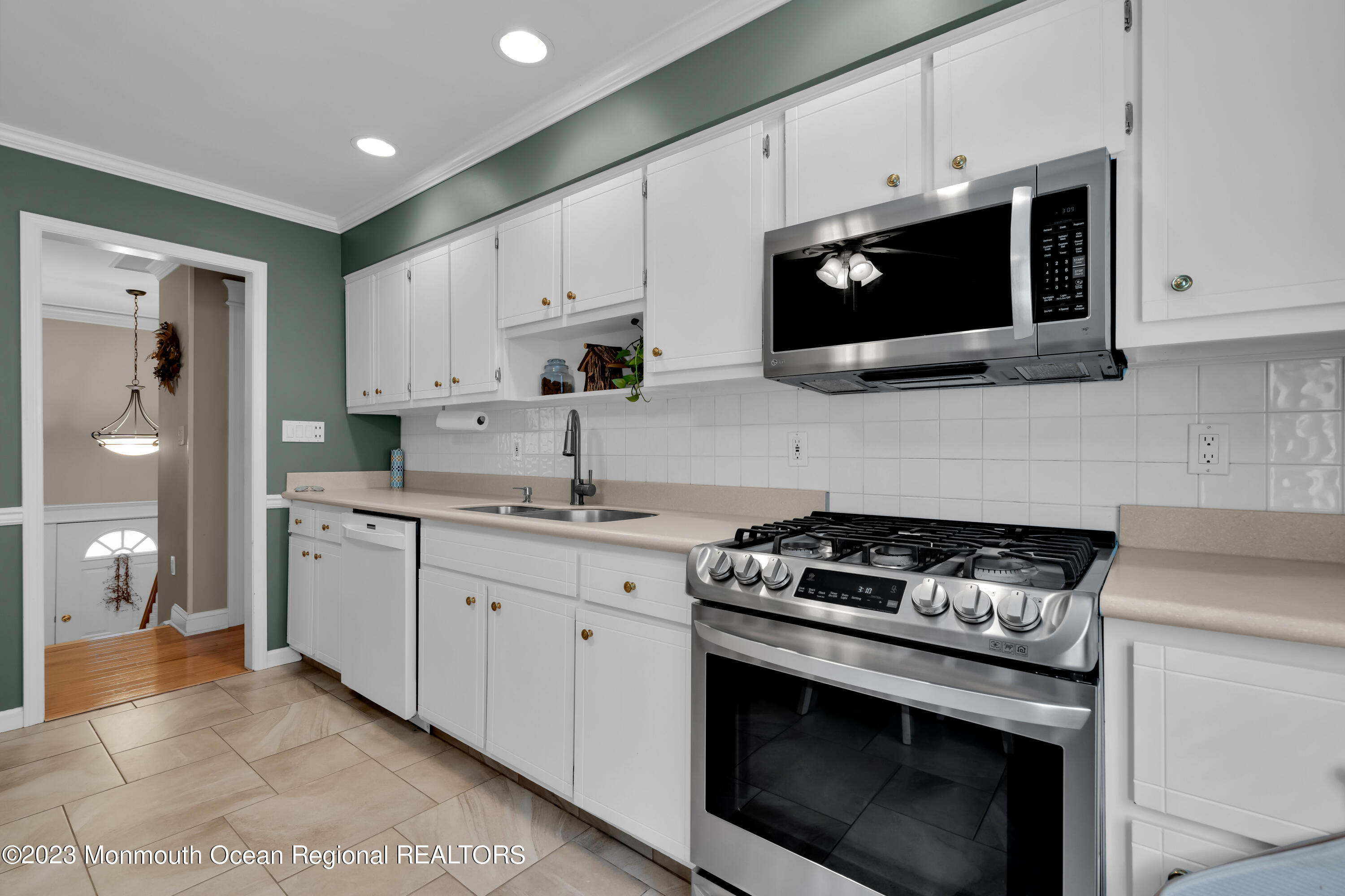 442 Frank Applegate Road Jackson, NJ 08527 - Photo 32 of 88 a kitchen with stainless steel appliances granite countertop white cabinets a microwave oven and a sink