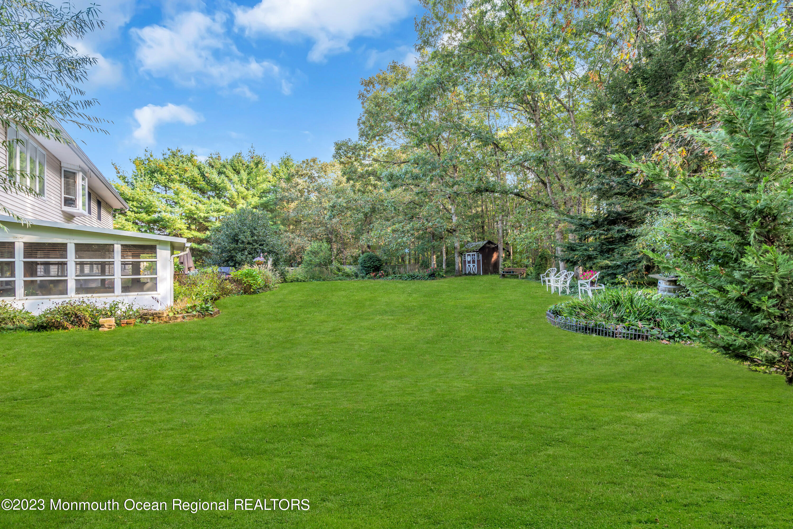 442 Frank Applegate Road Jackson, NJ 08527 - Photo 61 of 88 a view of a big yard with plants and large tree