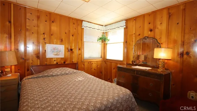 a bedroom with a bed and a lamp