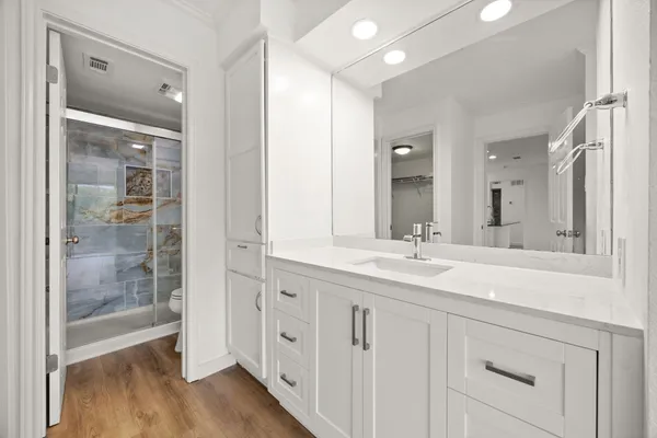 a bathroom with a shower and toilet