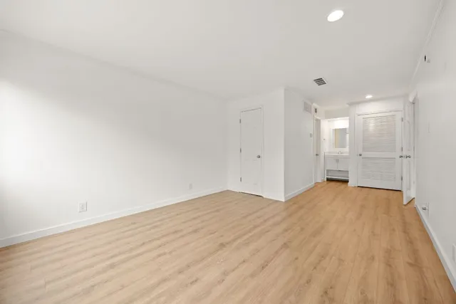 a view of a hallway with washer and dryer