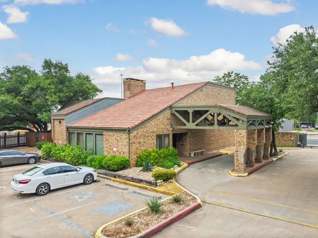 an aerial view of a house with outdoor space