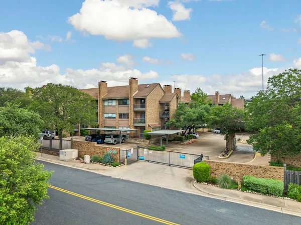 an aerial view of a house with outdoor space