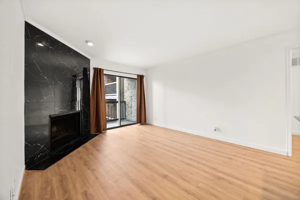 a view of kitchen with kitchen island microwave and stove