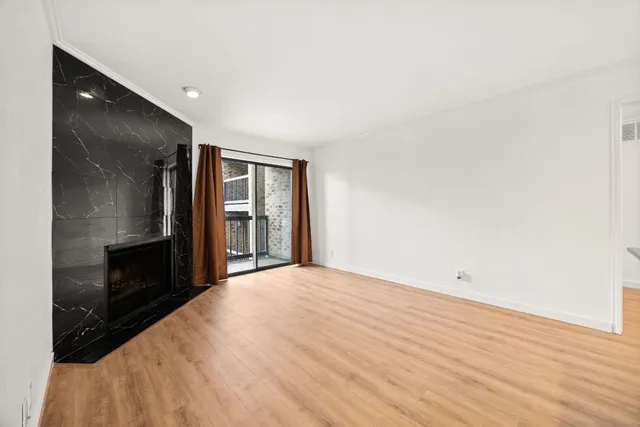 a view of kitchen with kitchen island microwave and stove