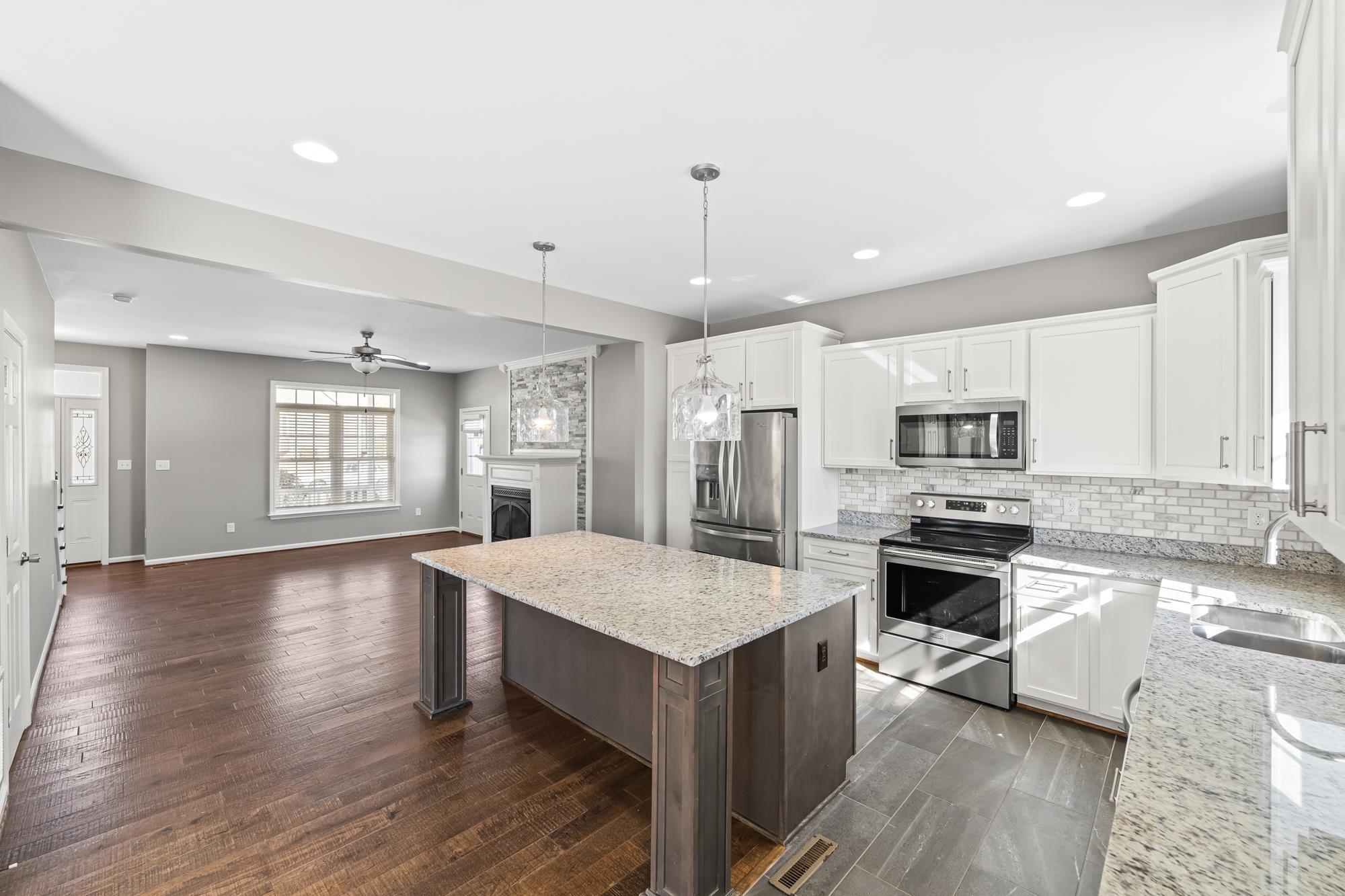 8 Mcilwee Lane Staunton, VA 24401 - Photo 11 of 56 a large kitchen with stainless steel appliances granite countertop a stove a sink dishwasher and a oven with white cabinets