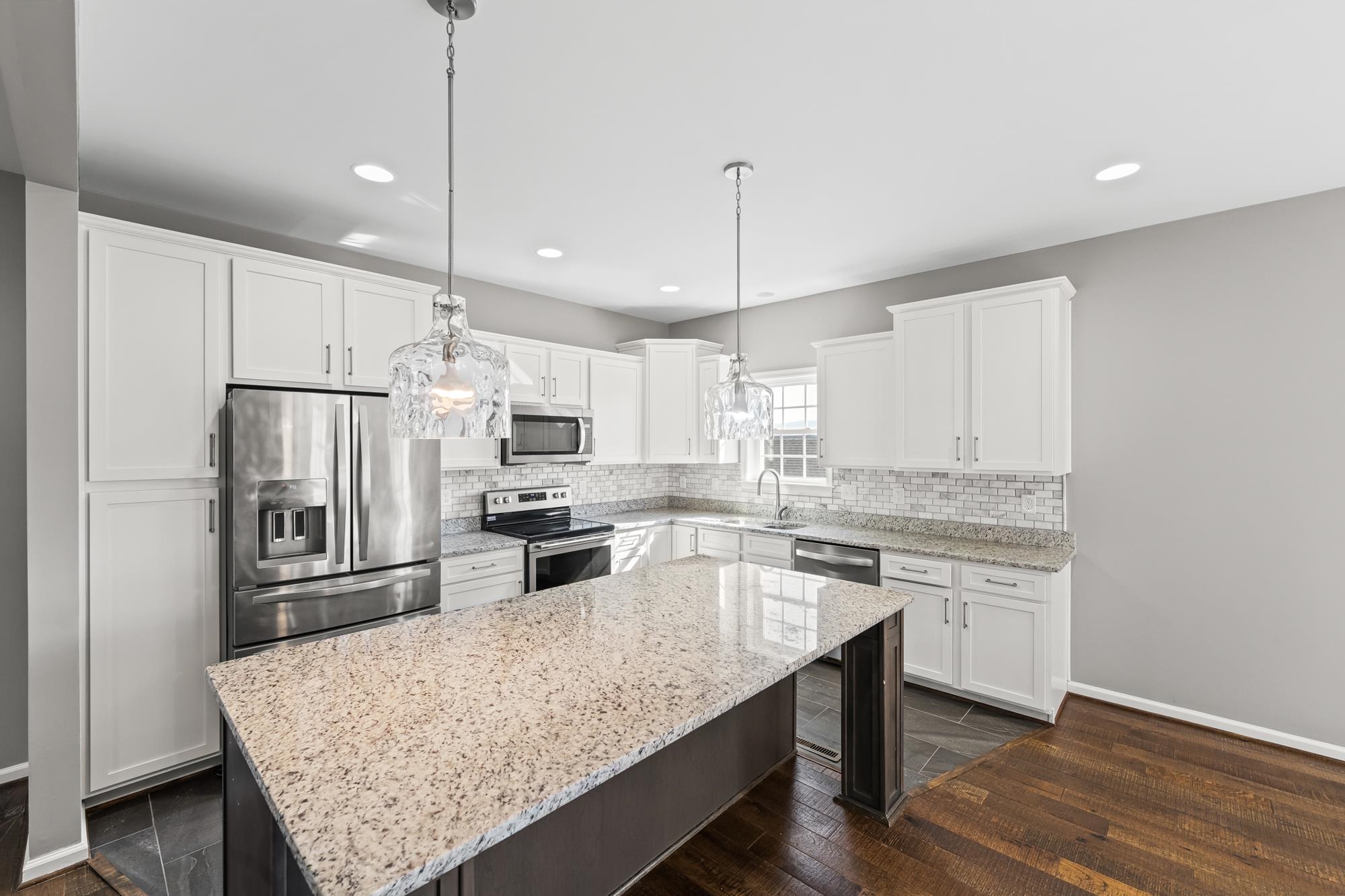 8 Mcilwee Lane Staunton, VA 24401 - Photo 12 of 56 a kitchen with stainless steel appliances granite countertop a refrigerator stove microwave and cabinets