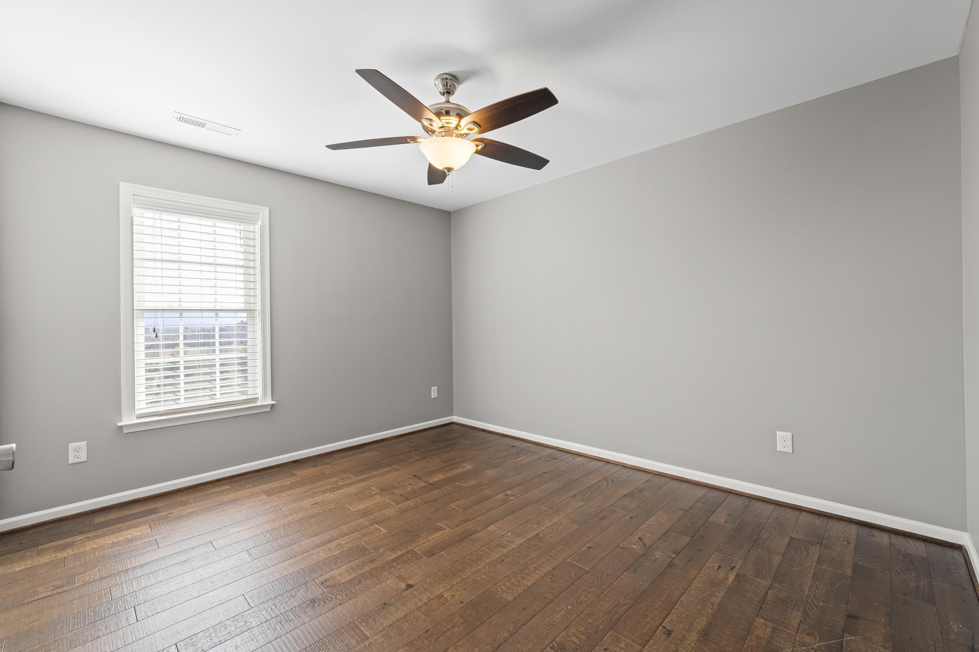 8 Mcilwee Lane Staunton, VA 24401 - Photo 23 of 56 an empty room with wooden floor fan and windows