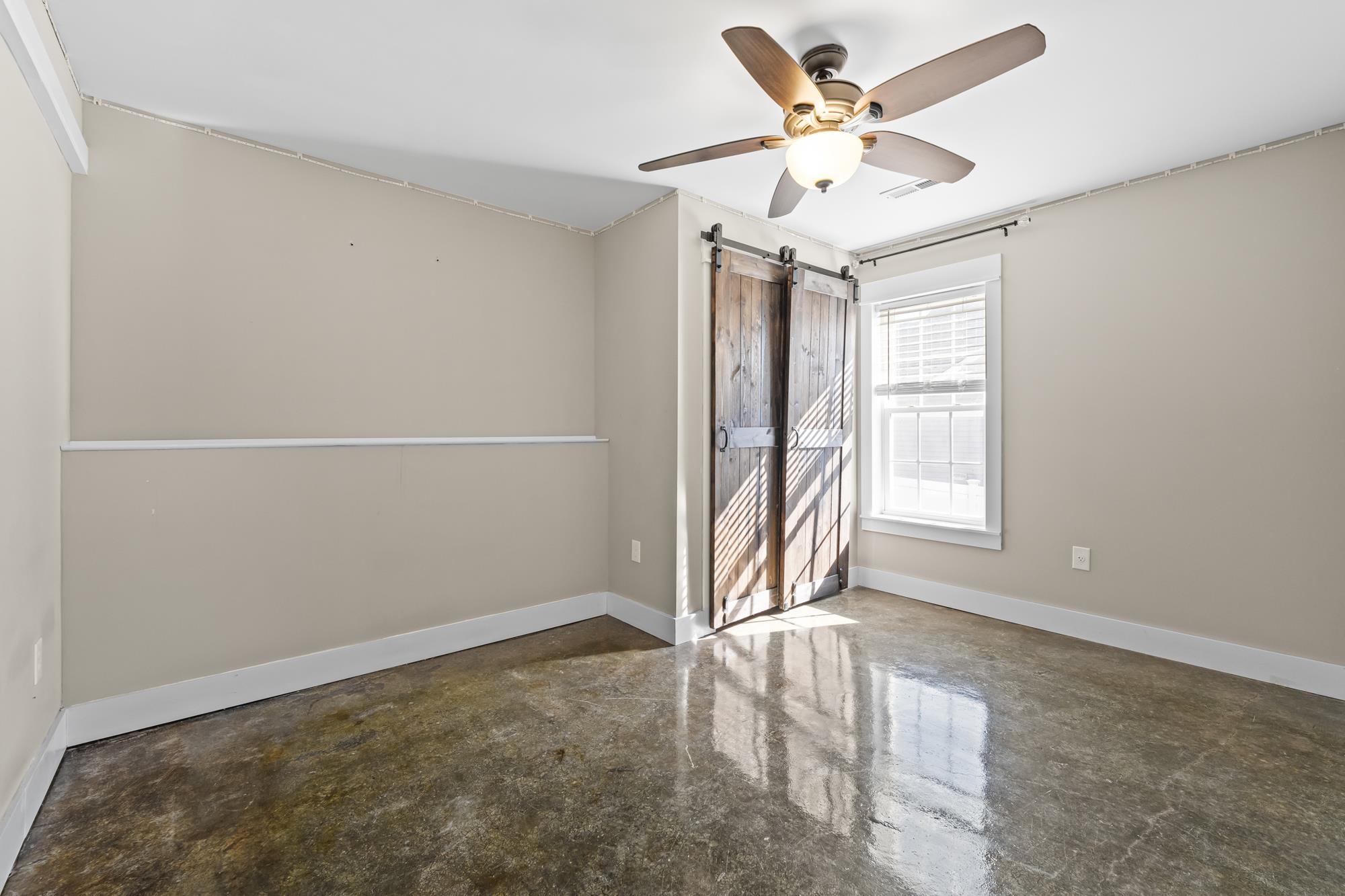 8 Mcilwee Lane Staunton, VA 24401 - Photo 41 of 56 an empty room with a ceiling fan and window