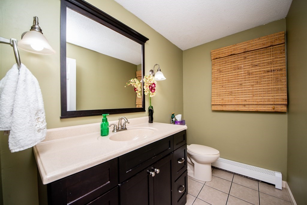 16 Gammons Road Acushnet, MA 02743 - Photo 25 of 31 a bathroom with a sink vanity and a mirror