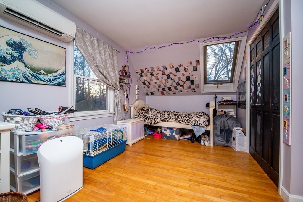 16 Gammons Road Acushnet, MA 02743 - Photo 29 of 31 a bedroom with a bed and a fireplace