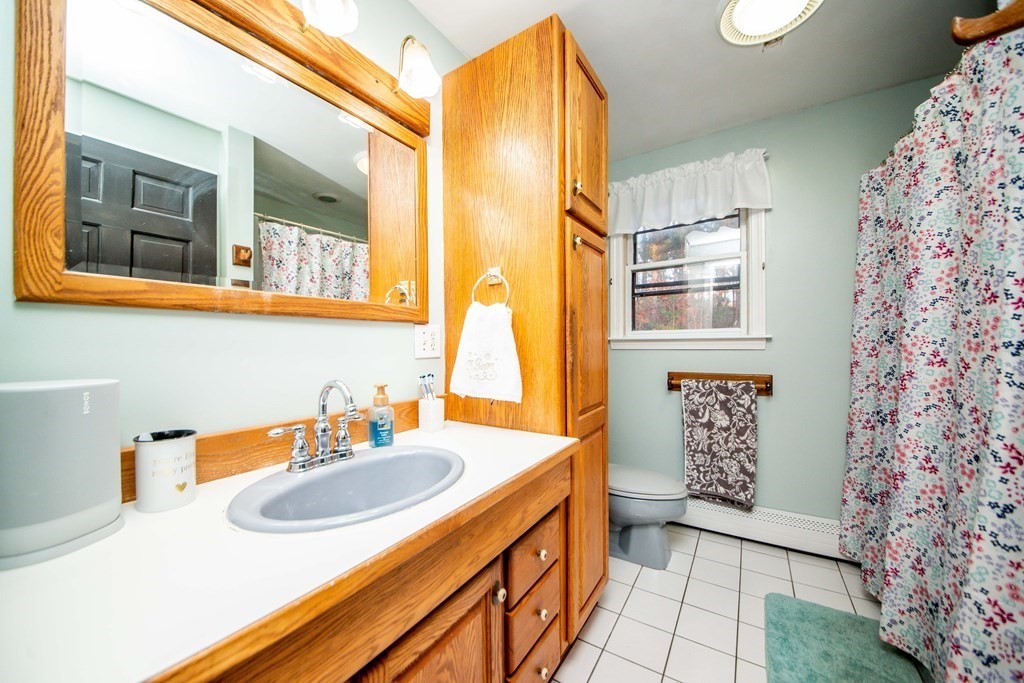 16 Gammons Road Acushnet, MA 02743 - Photo 31 of 31 a bathroom with a sink and a mirror