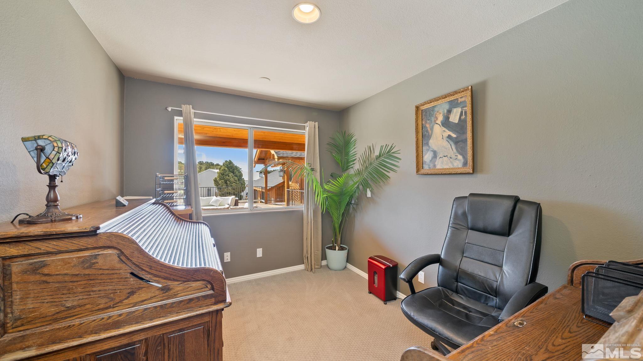 21311 Grande Road Reno, NV 89521 - Photo 26 of 37 a room with furniture and a window
