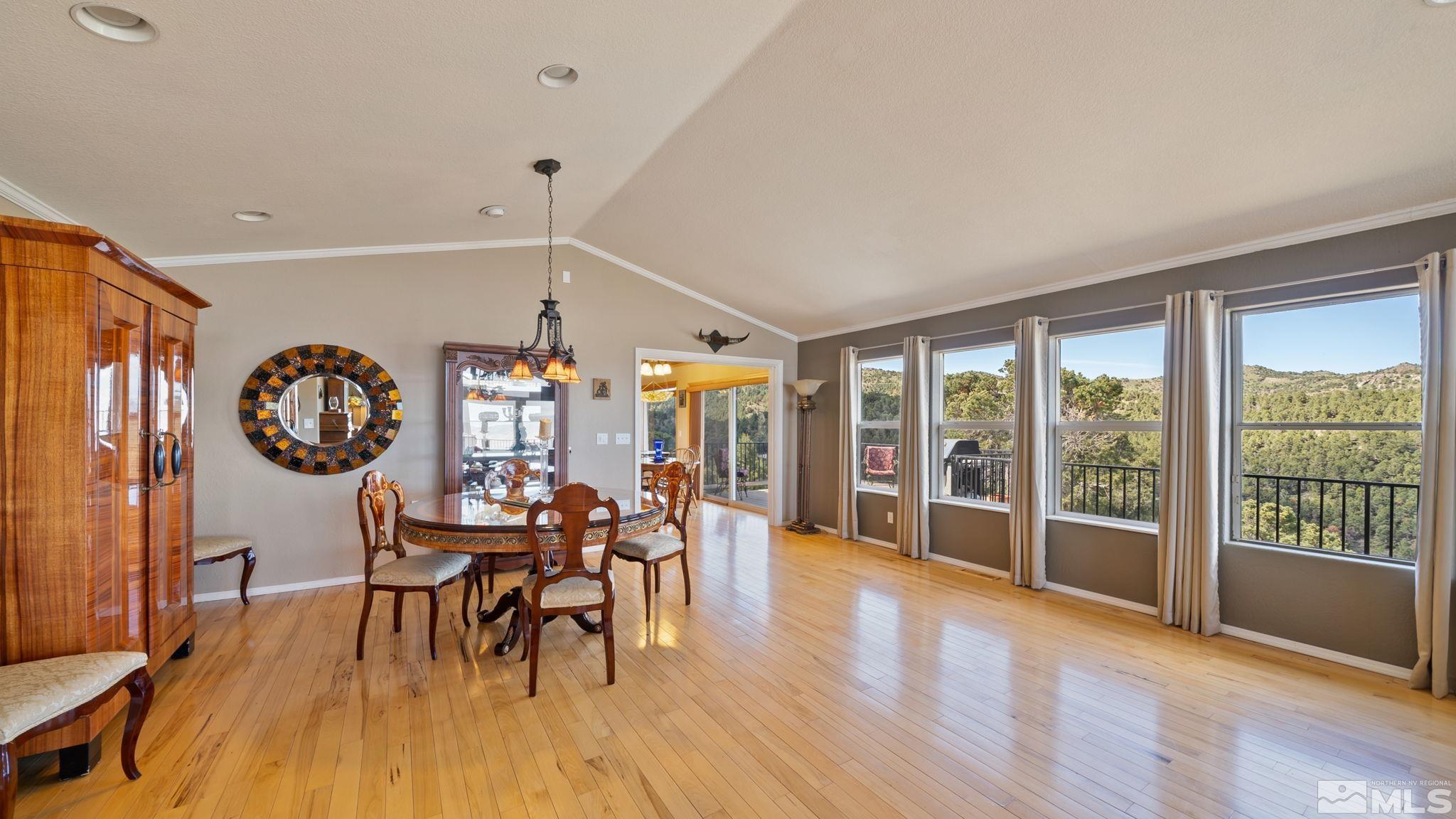 21311 Grande Road Reno, NV 89521 - Photo 9 of 37 a view of a dining room with furniture window and wooden floor