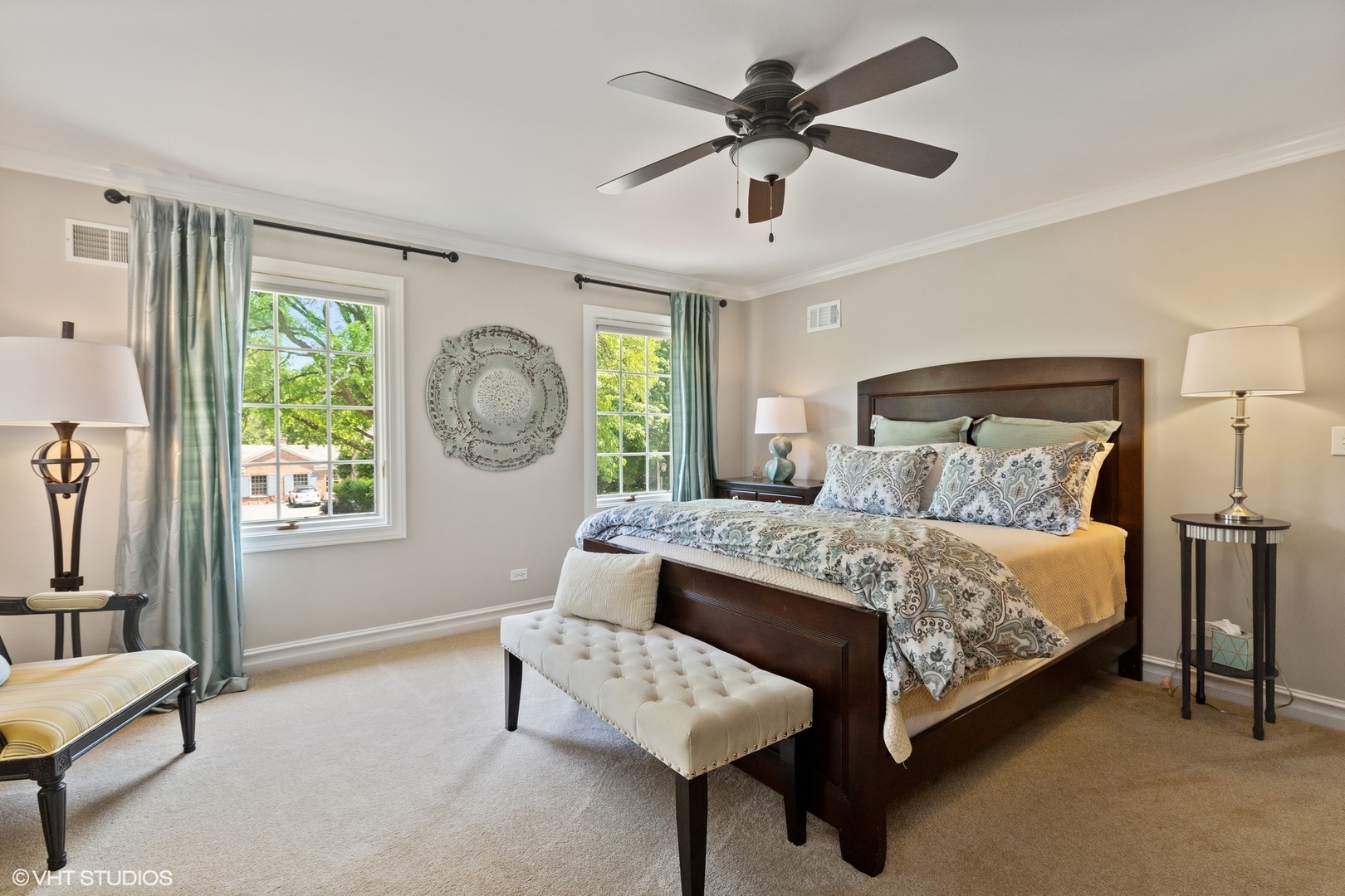 440 King Muir Road Lake Forest, IL 60045 - Photo 24 of 36 a bedroom with a large bed a chandelier and a couch