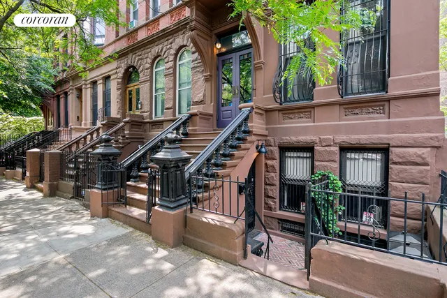 a kitchen with stainless steel appliances kitchen island granite countertop a sink and cabinets
