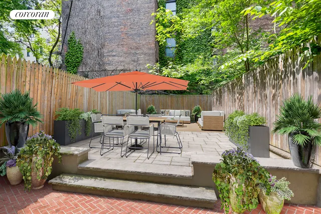 a spacious bedroom with a balcony a bed and a couch with window